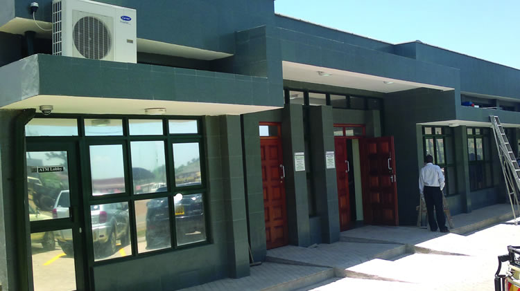 Exterior of Cooperative bank in plaster and grey paint finish