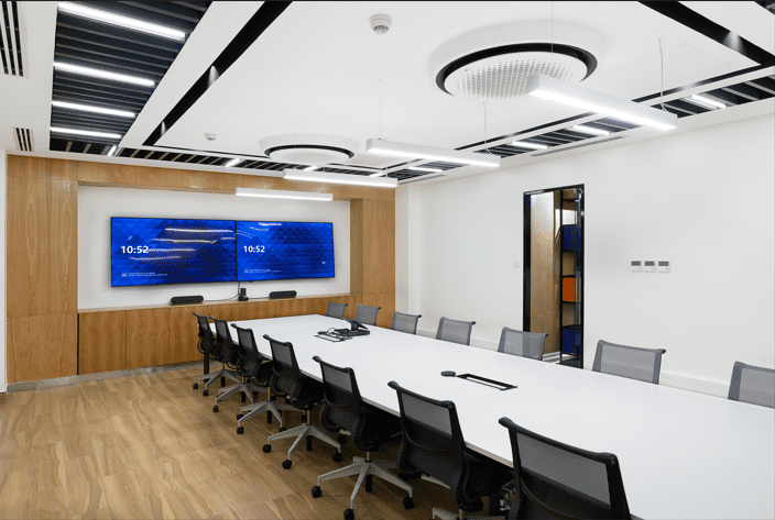 Office space showing board room with whiteboard at the front for BAT offices in Industrial area