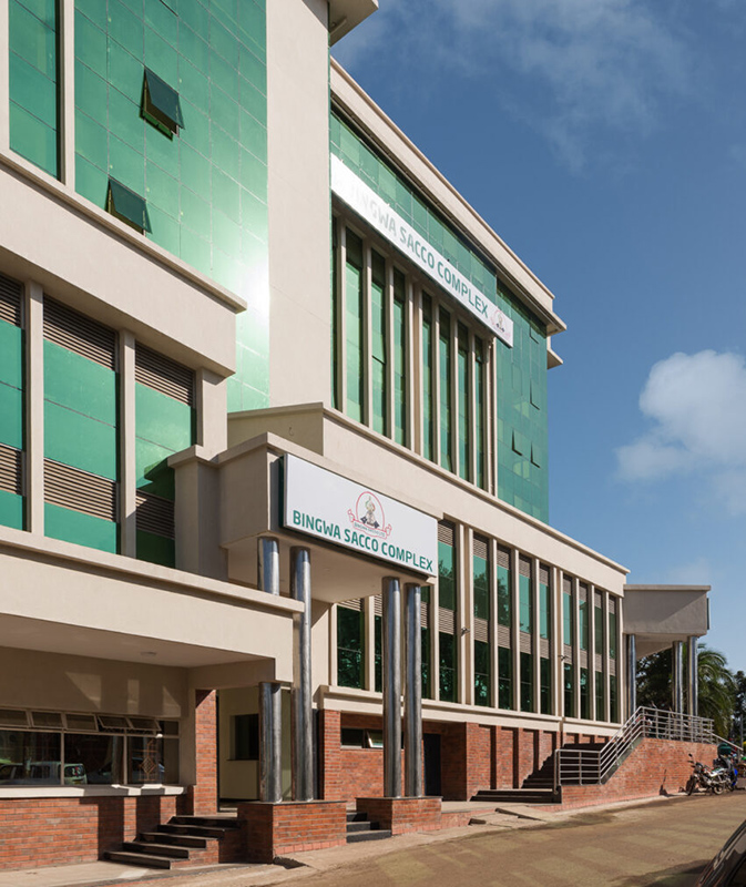 An exterior view of Bingwa Sacco headquarters building in Kerugoya town, highlighting green reflective glass on the facade