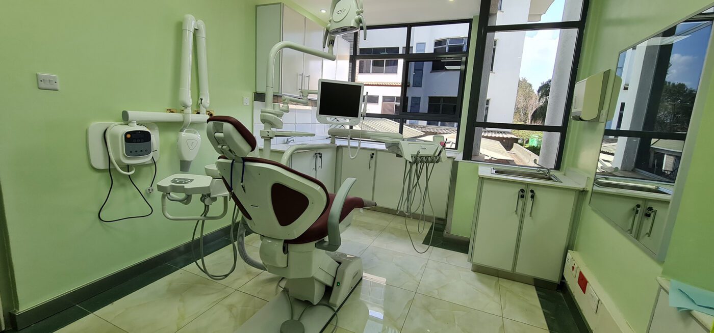 Interior of Karen Hospital dental unit showing dental chair and window with view to outside