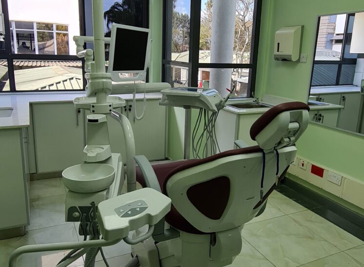 Interior of Karen Hospital dental unit showing dental chair and window with view to outside