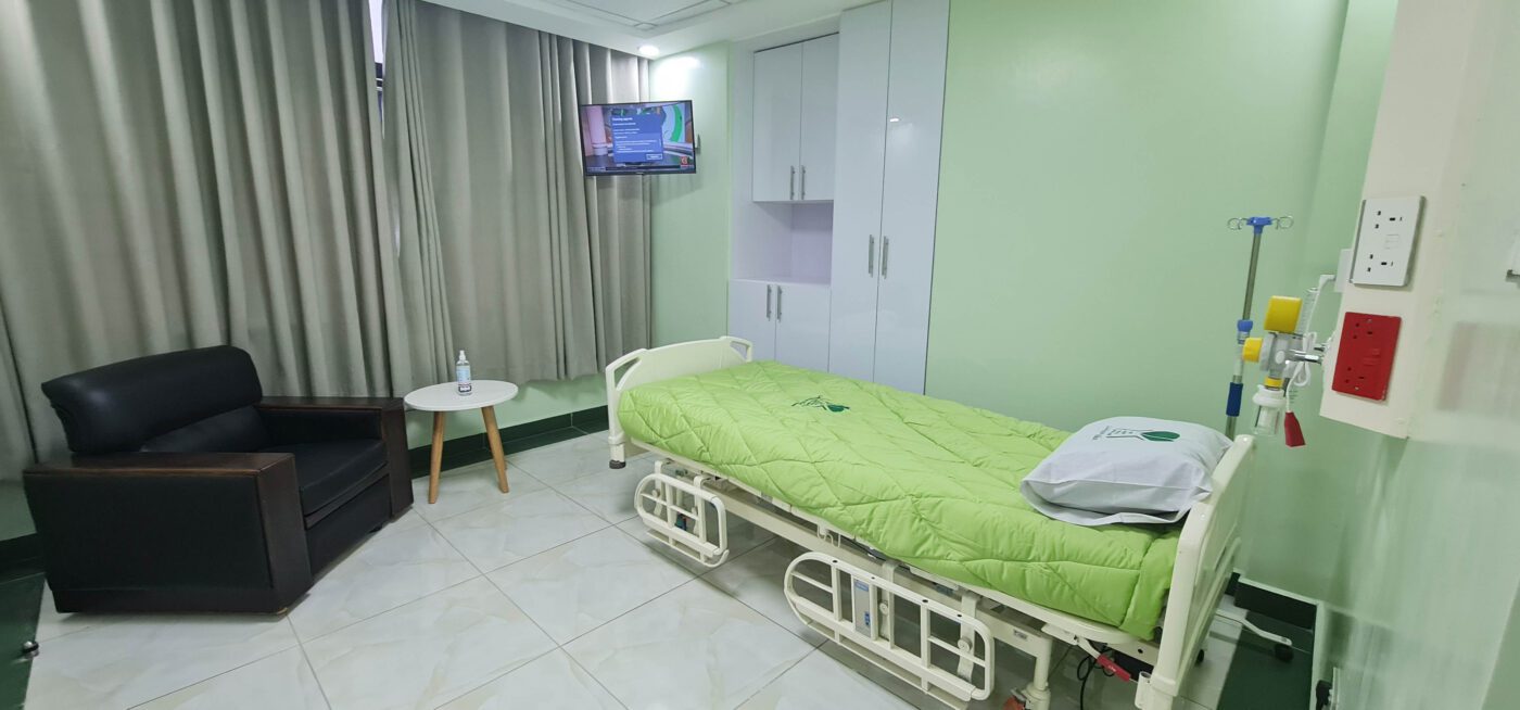The interior of Karen Hospital patient suite, showing a bed